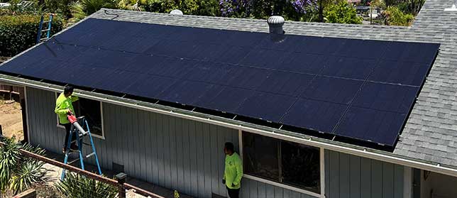 RC workers are installing solar on a home